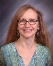 Picture of woman with long blonde hair and glasses